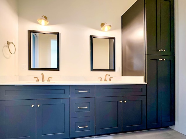 full bath featuring double vanity and a sink