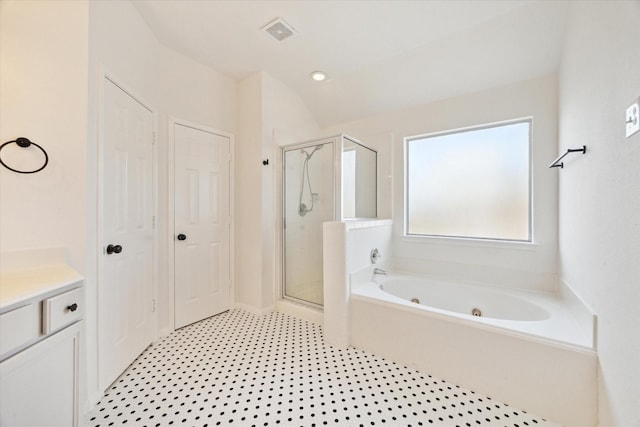 full bathroom with a garden tub, vanity, visible vents, a closet, and a stall shower