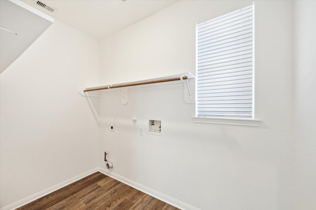 clothes washing area with laundry area, visible vents, gas dryer hookup, dark wood-style floors, and hookup for a washing machine