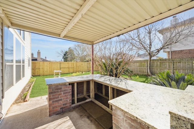 view of patio / terrace featuring a fenced backyard and outdoor dry bar