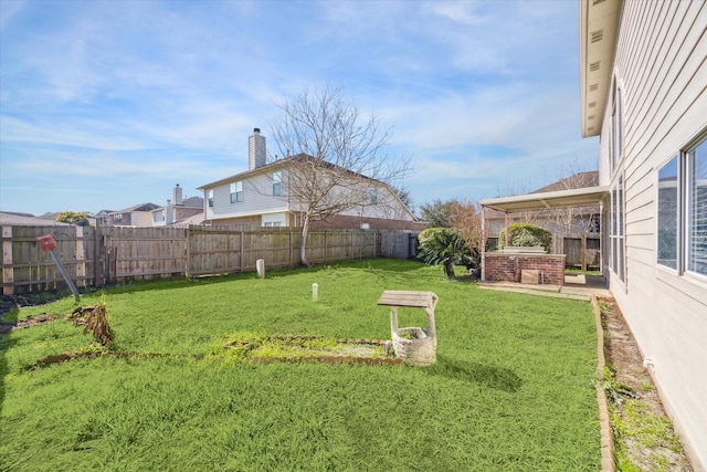 view of yard with a fenced backyard and a patio