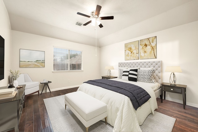 bedroom featuring dark wood-style floors, visible vents, ceiling fan, and baseboards