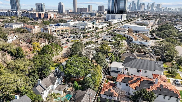 birds eye view of property with a view of city