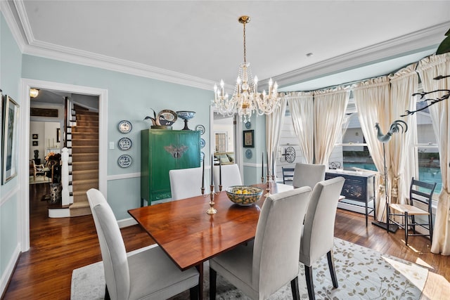 dining room with baseboards, wood finished floors, stairs, crown molding, and a notable chandelier