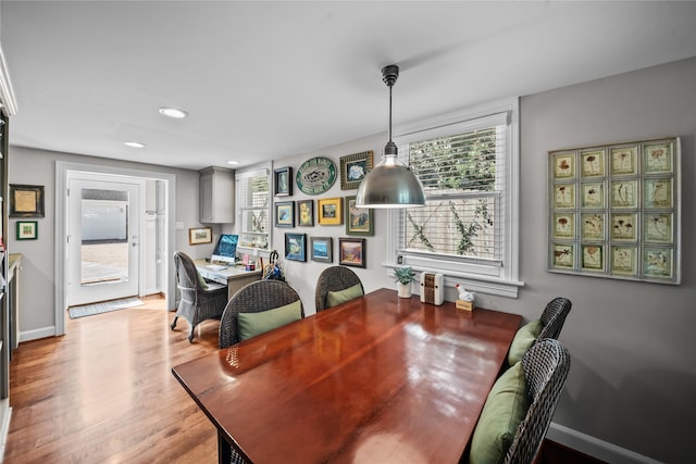 dining space with light wood-type flooring, baseboards, and recessed lighting