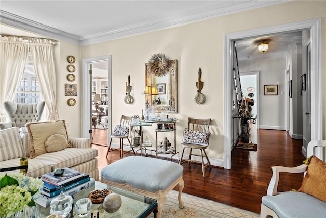 living area featuring ornamental molding, dark wood finished floors, and baseboards