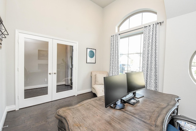 office with a high ceiling, baseboards, dark wood finished floors, and french doors