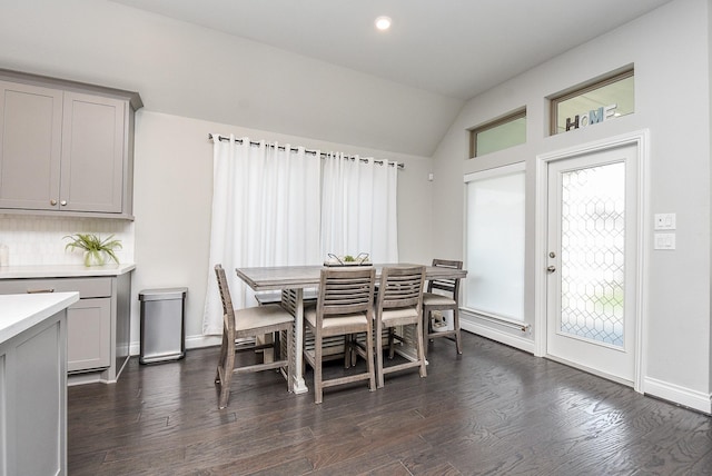 dining area featuring lofted ceiling, dark wood-style floors, baseboards, and recessed lighting