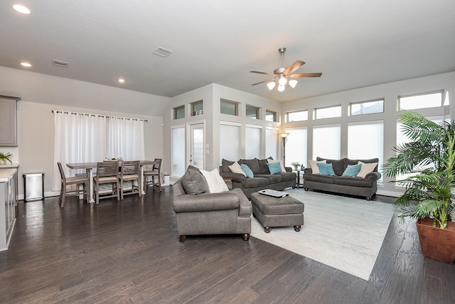 living room featuring recessed lighting, dark wood finished floors, visible vents, and a ceiling fan