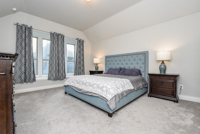 bedroom featuring carpet floors, vaulted ceiling, and baseboards