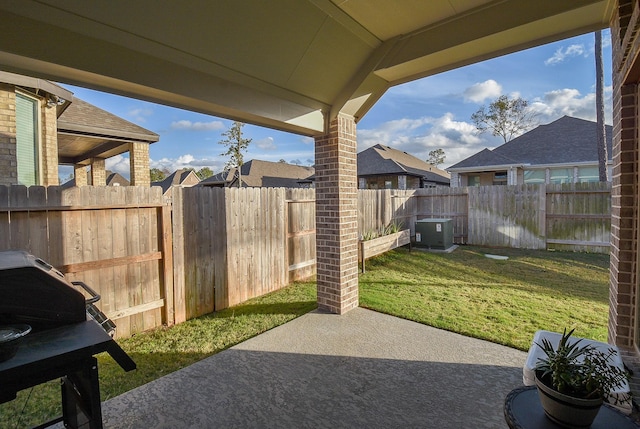 view of patio / terrace featuring central air condition unit and a fenced backyard