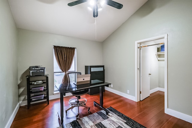 office featuring lofted ceiling, ceiling fan, dark wood-style flooring, and baseboards