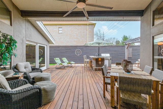 wooden deck featuring ceiling fan, outdoor dining area, area for grilling, and a pergola