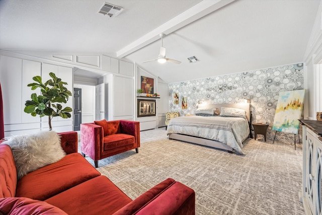 bedroom featuring lofted ceiling with beams, wallpapered walls, visible vents, and light colored carpet