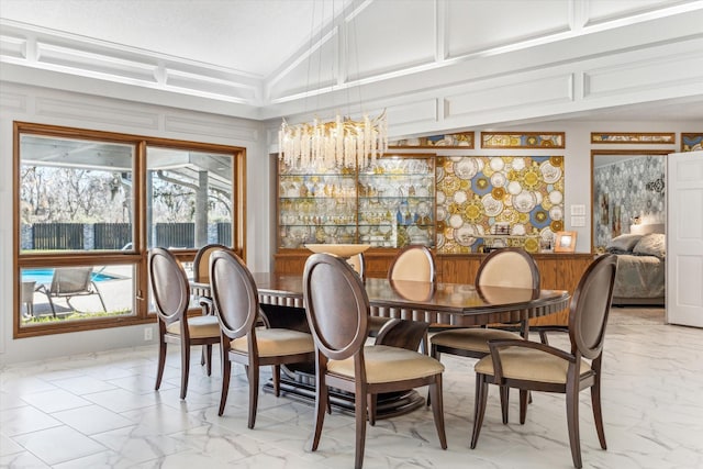 dining area with marble finish floor and high vaulted ceiling