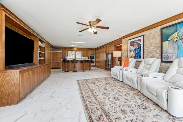 living area with marble finish floor, visible vents, crown molding, and ceiling fan