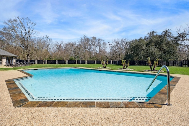 view of pool with a lawn, fence, and a fenced in pool