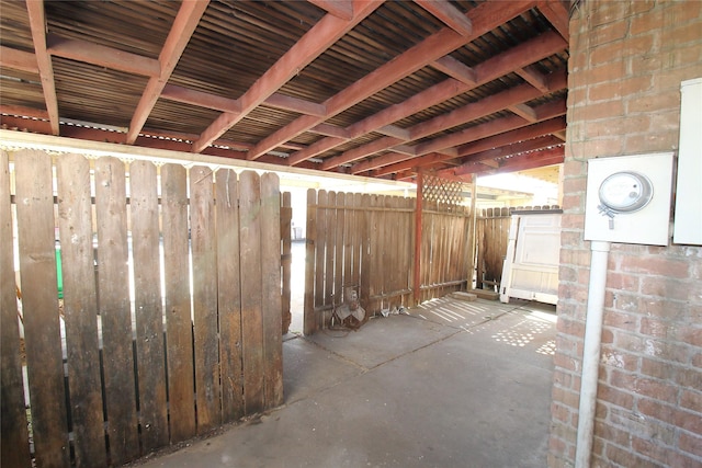 view of patio featuring fence