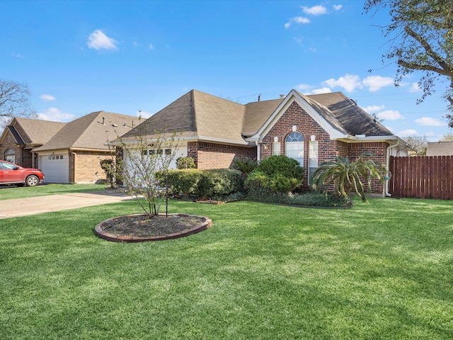 view of front of home with a front lawn, brick siding, fence, and an attached garage