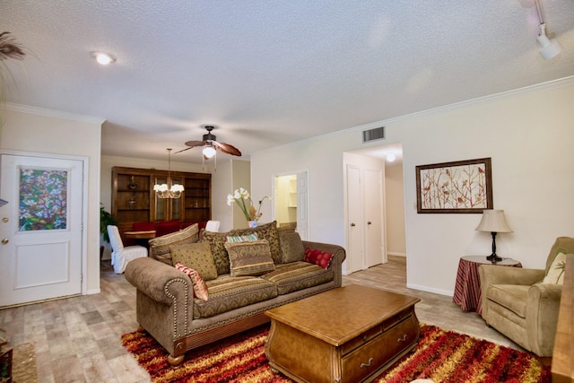 living area with a textured ceiling, visible vents, baseboards, light wood-style floors, and crown molding