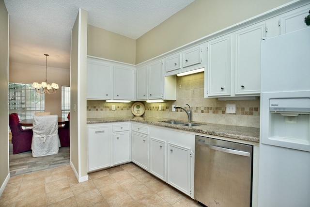 kitchen featuring a sink, white cabinets, backsplash, dishwasher, and white fridge with ice dispenser