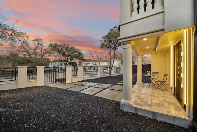 exterior space with outdoor dining space and fence private yard