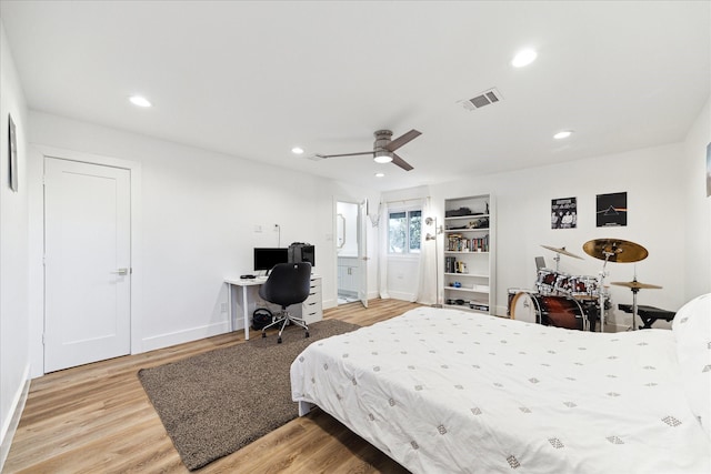 bedroom featuring baseboards, visible vents, a ceiling fan, wood finished floors, and recessed lighting