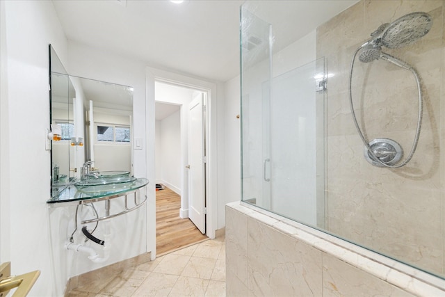 full bathroom with vanity and walk in shower