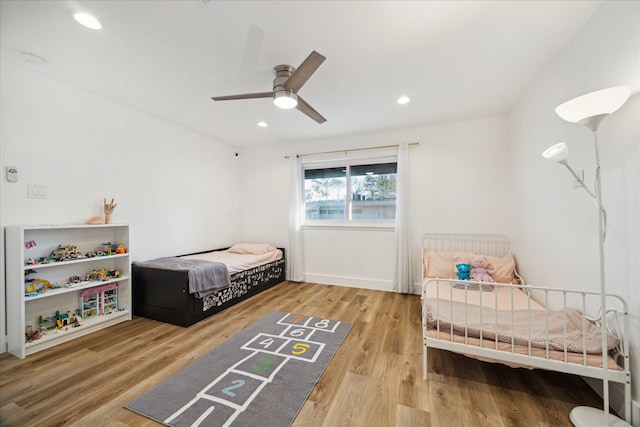 bedroom featuring a ceiling fan, recessed lighting, and wood finished floors