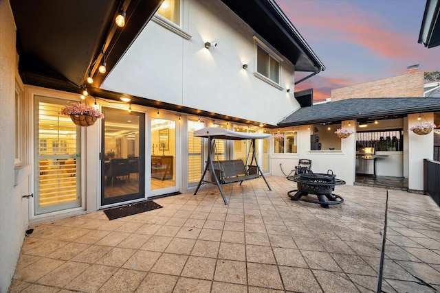 view of patio featuring a fire pit