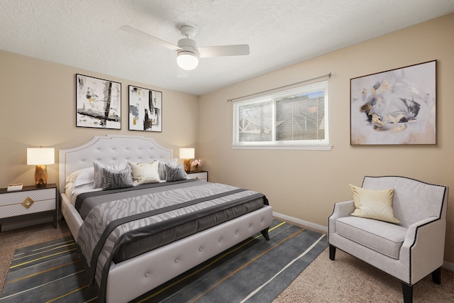 carpeted bedroom with a ceiling fan, baseboards, and a textured ceiling