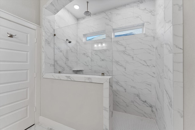 bathroom with marble finish floor and a marble finish shower