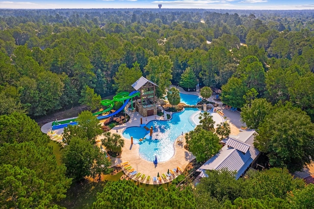 birds eye view of property featuring a forest view