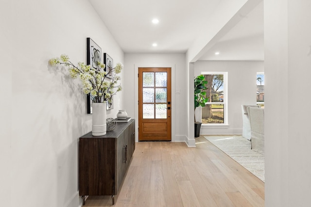 entrance foyer featuring light wood-style floors, baseboards, and recessed lighting