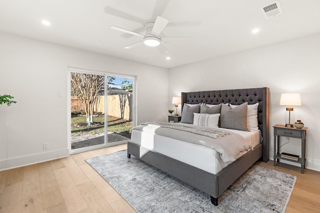 bedroom with access to exterior, visible vents, light wood finished floors, and recessed lighting