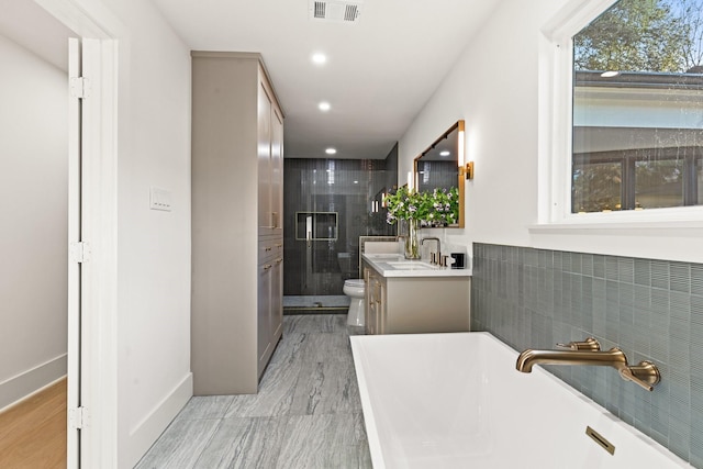 full bath featuring a stall shower, visible vents, toilet, vanity, and recessed lighting