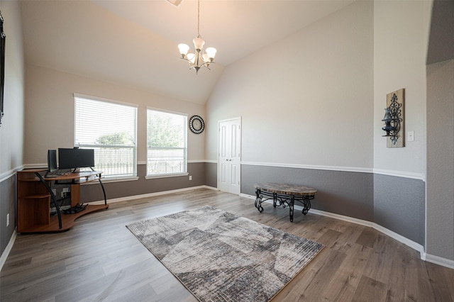 home office with high vaulted ceiling, baseboards, a chandelier, and wood finished floors