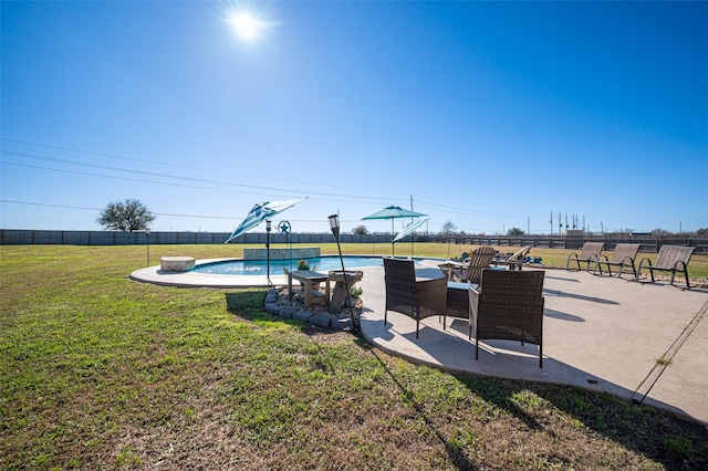 view of yard with a fenced in pool, a patio area, and fence