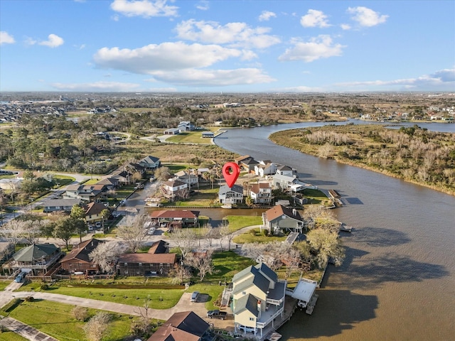 drone / aerial view featuring a residential view and a water view