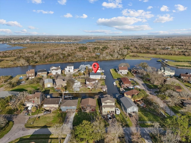 birds eye view of property with a water view and a residential view