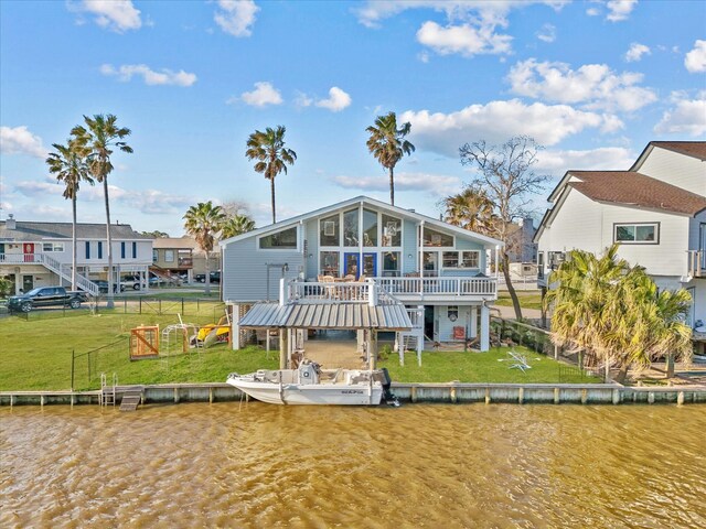 back of house with a residential view, a lawn, stairway, and a wooden deck