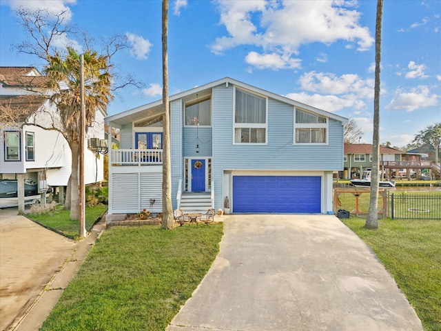 view of front of house with a garage, concrete driveway, a front lawn, and fence