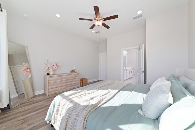 bedroom featuring recessed lighting, visible vents, ceiling fan, connected bathroom, and light wood-type flooring
