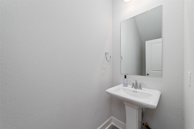 bathroom featuring baseboards