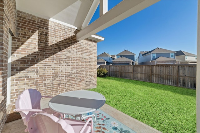 view of yard featuring a residential view and fence