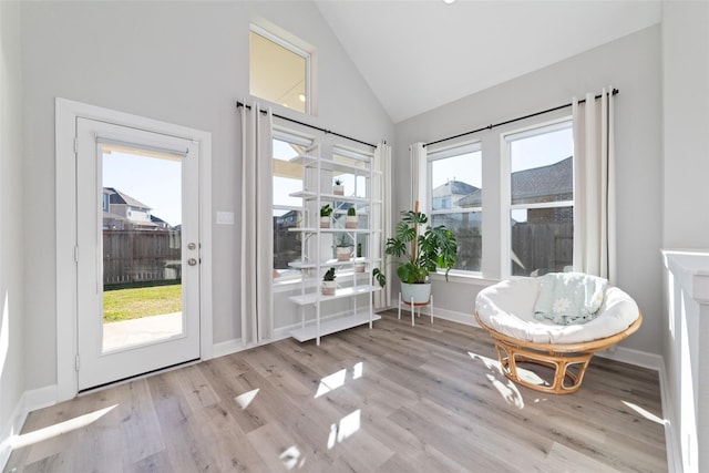 sunroom / solarium with vaulted ceiling