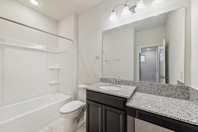 bathroom featuring shower / washtub combination, vanity, and toilet