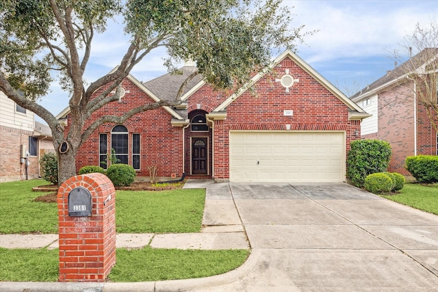 traditional-style home with concrete driveway, brick siding, an attached garage, and a front yard