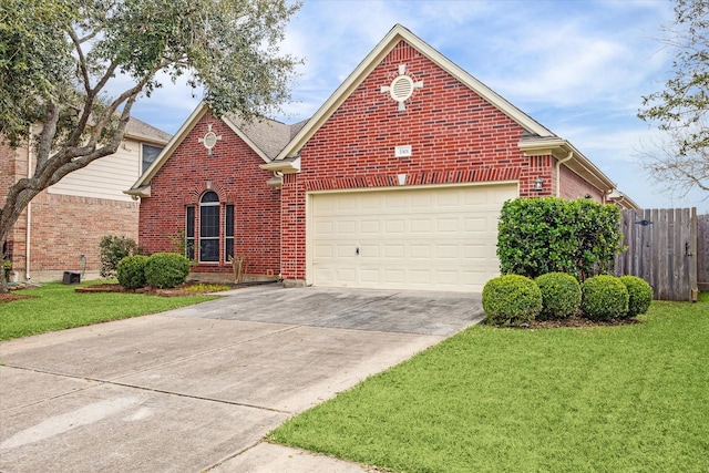 view of front of home featuring a garage, brick siding, concrete driveway, fence, and a front yard