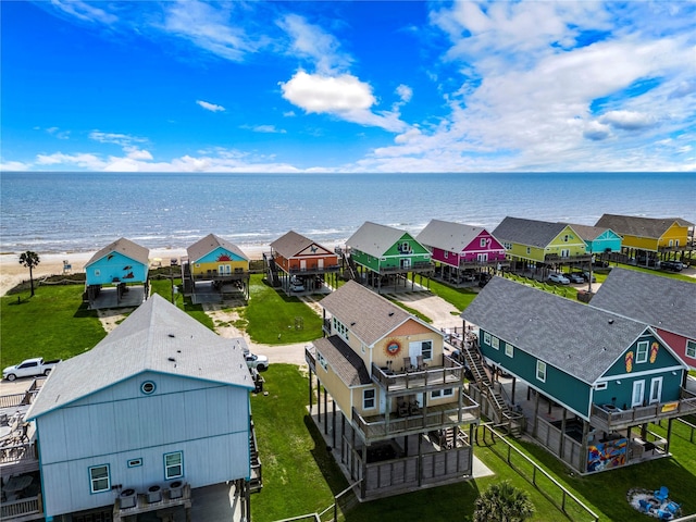 birds eye view of property featuring a water view and a residential view